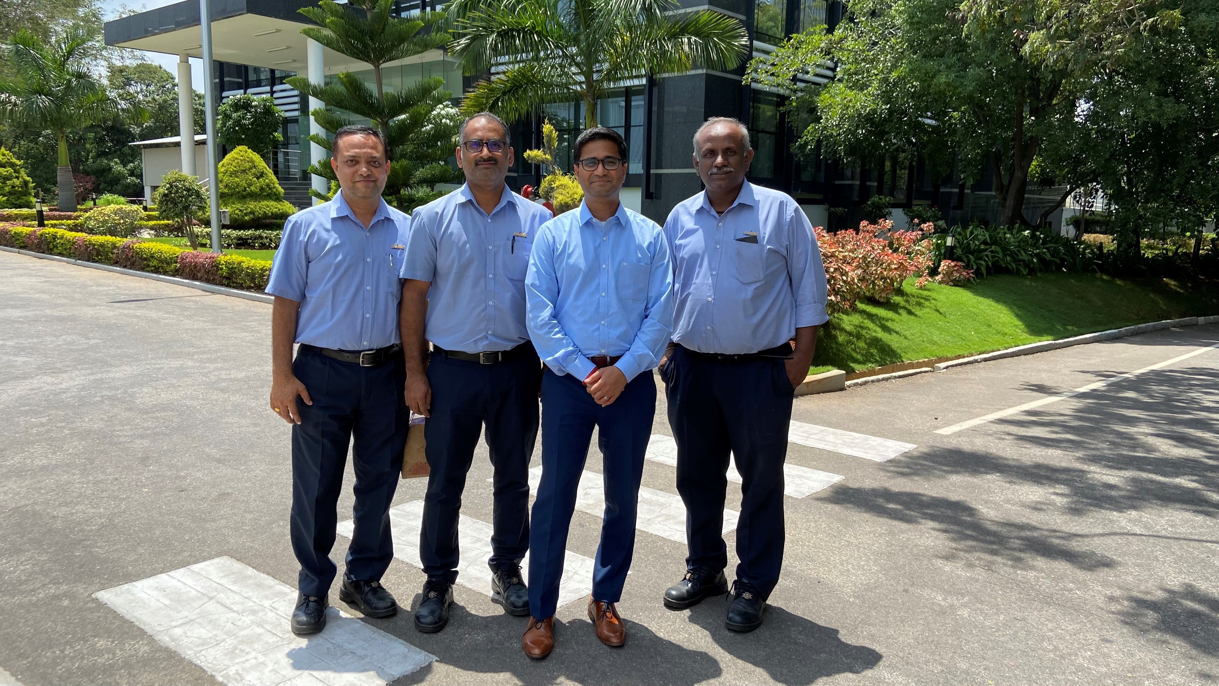 Four professional men standing in the street