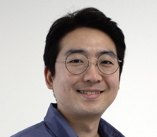 Photo of a smiling man with glasses