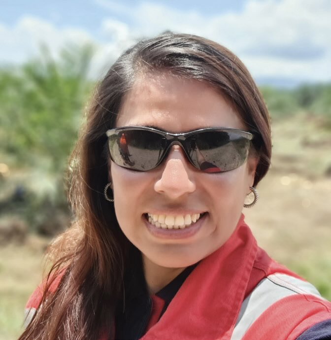 Photo of a smiling woman wearing sunglasses