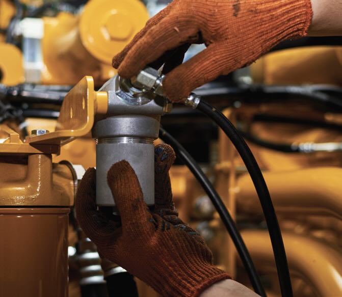 Gloved hands performing maintenance