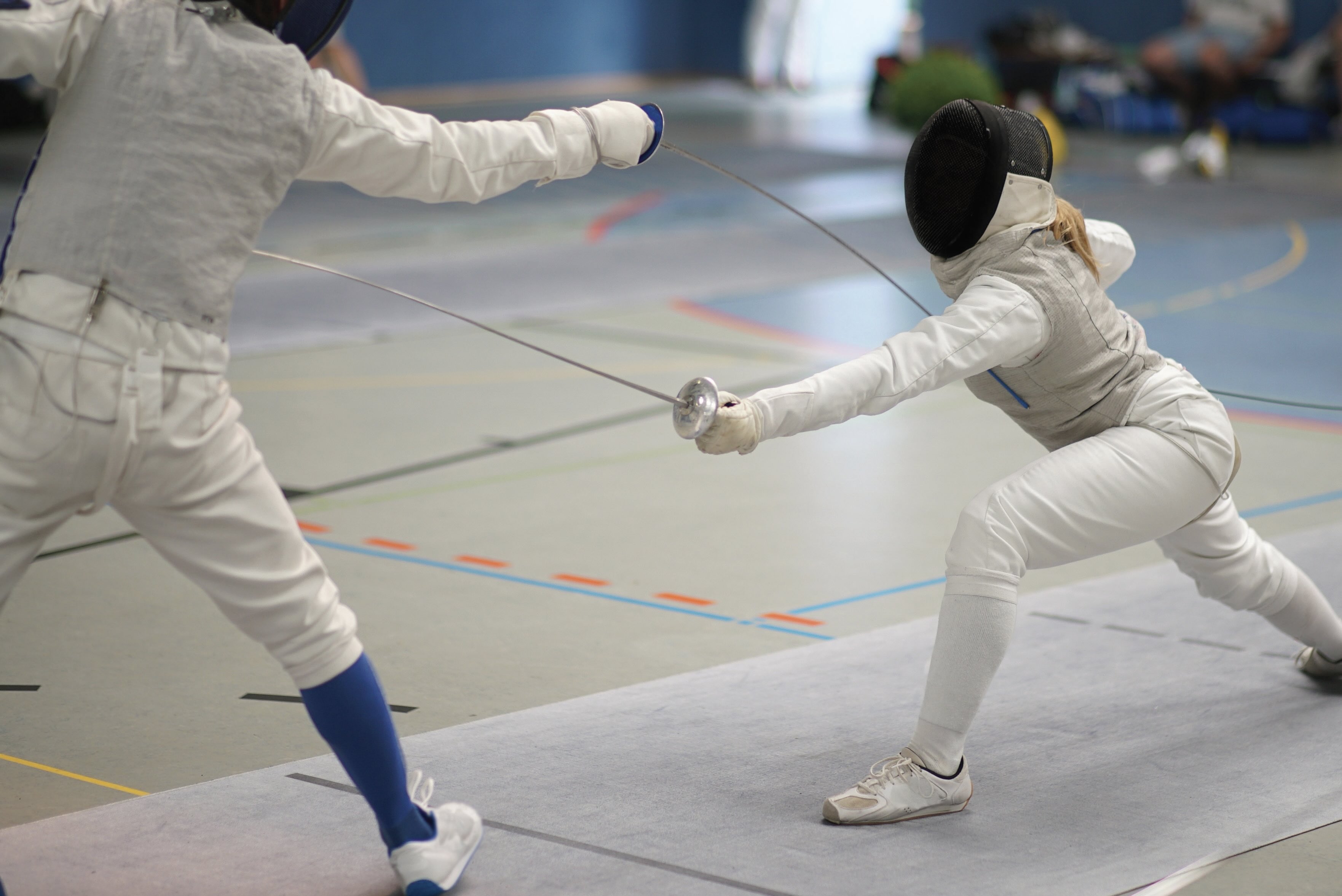 Two people fencing