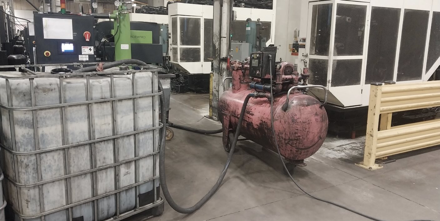Temporary coolant transfer setup using an air-operated pump and IBC tote during tank overhaul operations. This image shows how Garcia managed coolant reclamation and transfer between machines while performing deep clean maintenance.