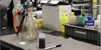 A science lab set up with an Erlenmeyer flask.